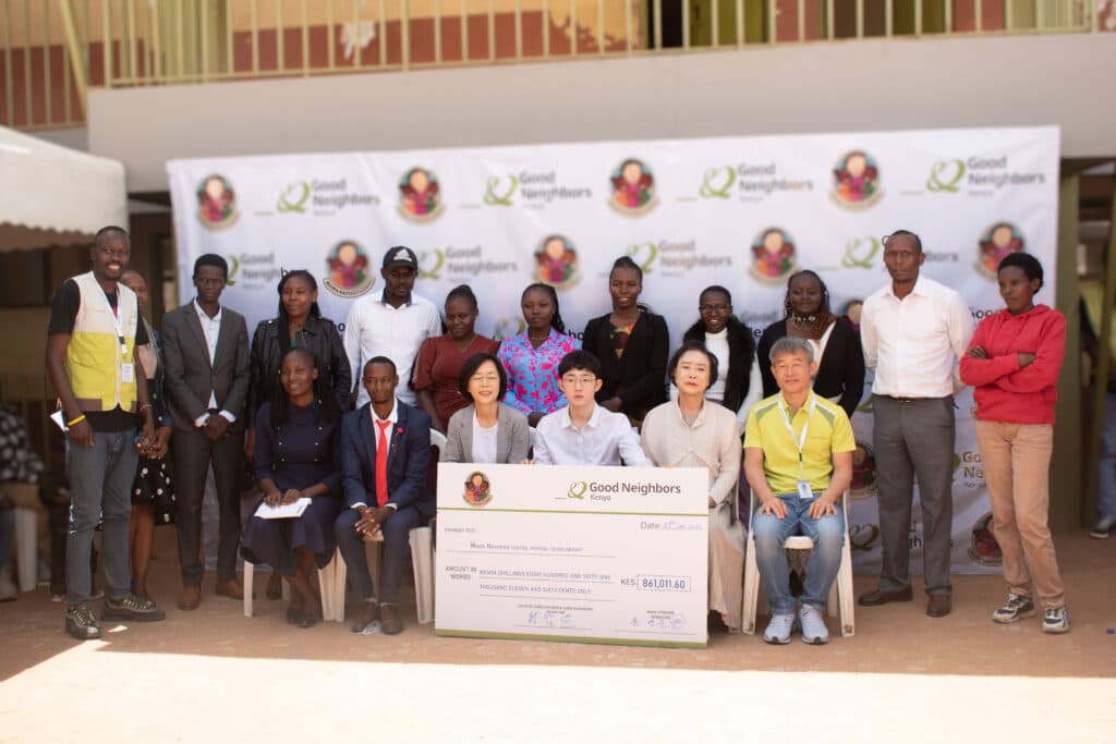 Good Neighbors Kenya staff and partners at a scholarship handover